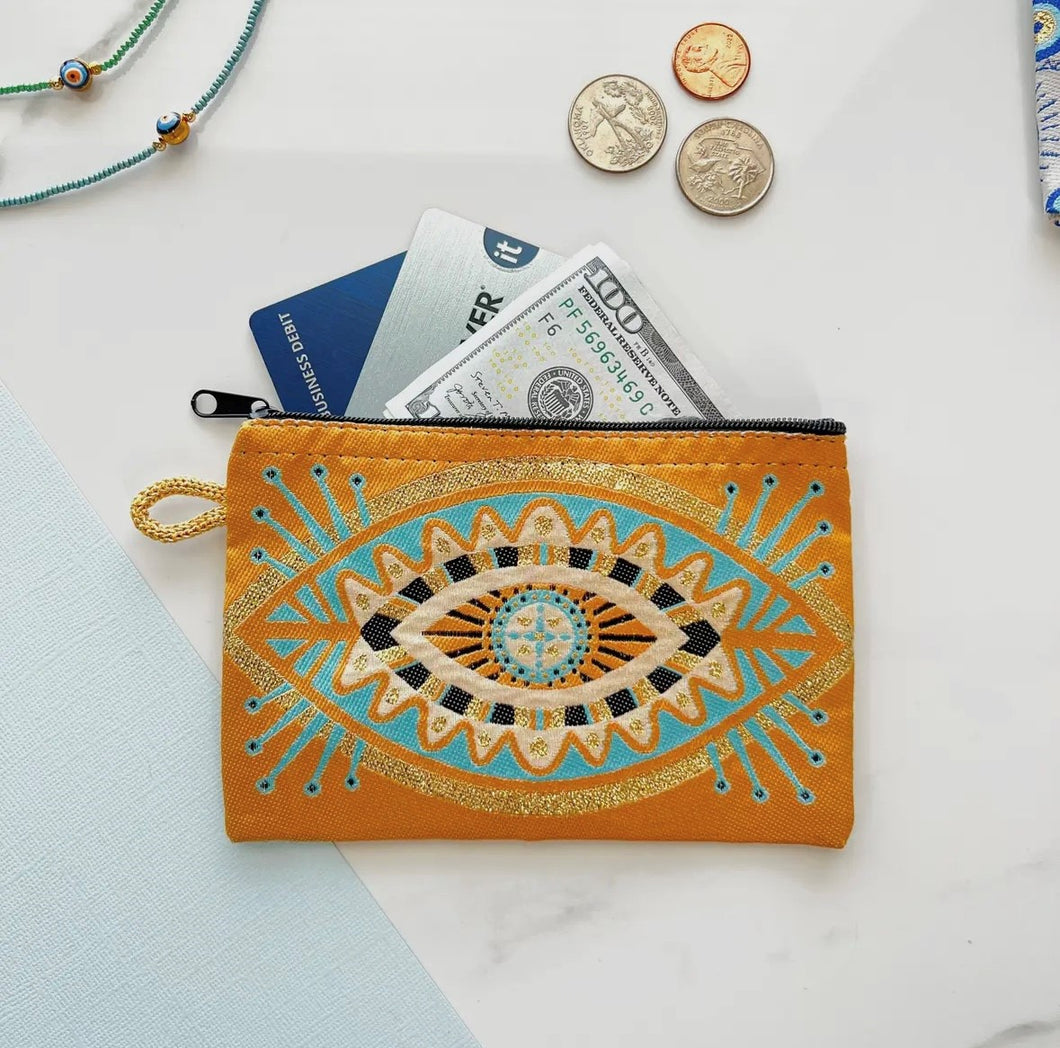 Gold and turquoise evil eye pouch