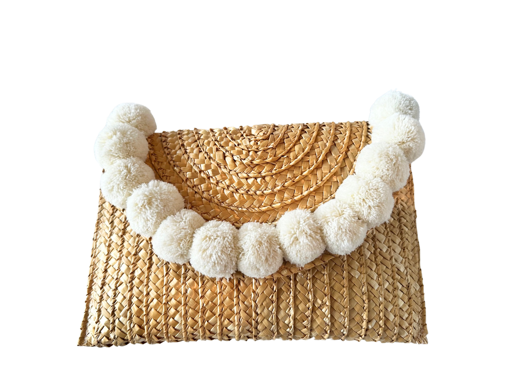 Woven pom pom clutch